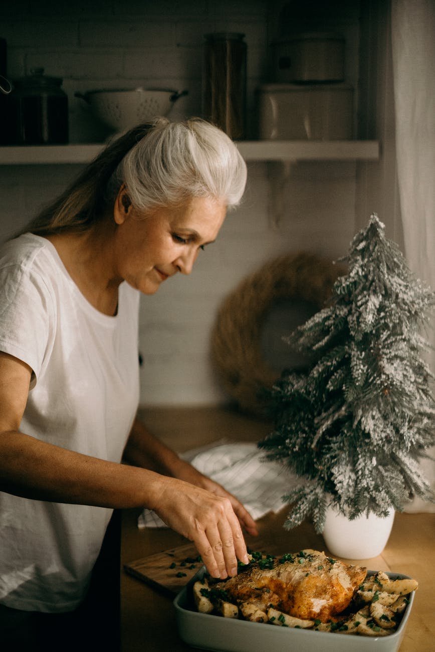 selective focus photography of standing woman in front of dish. smart money bro