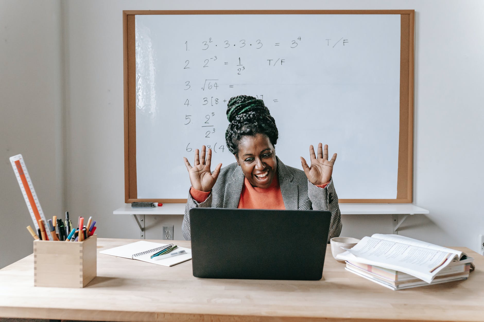 happy black woman using laptop for online work. smart money bro