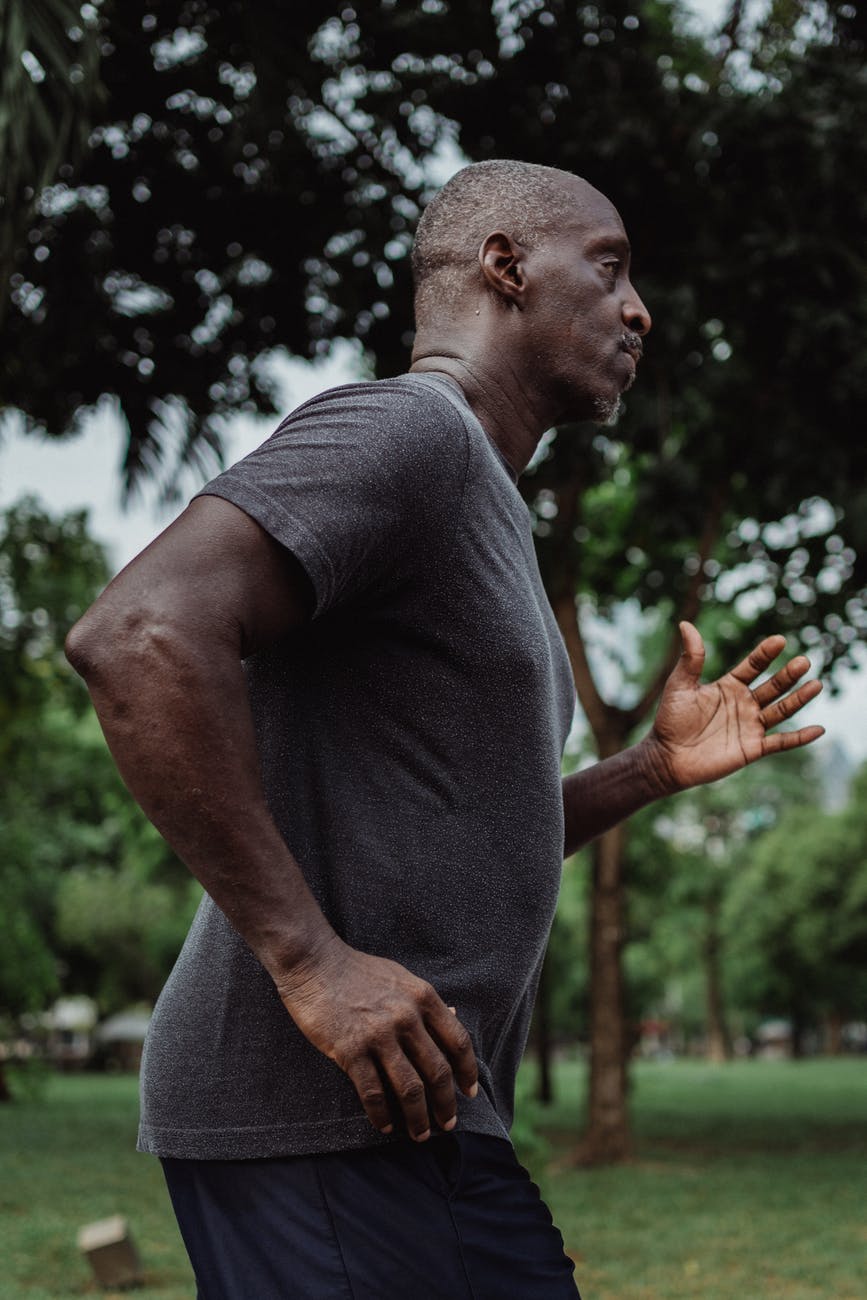 man in gray crew neck t shirt running