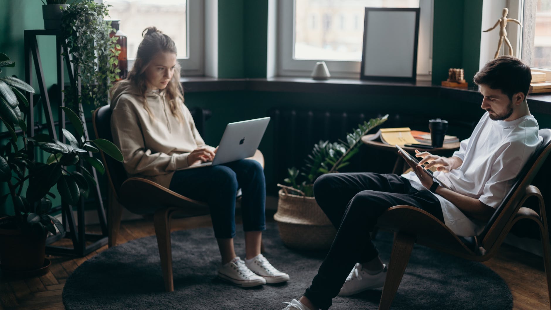 photo of two people using their gadgets, smart money bro