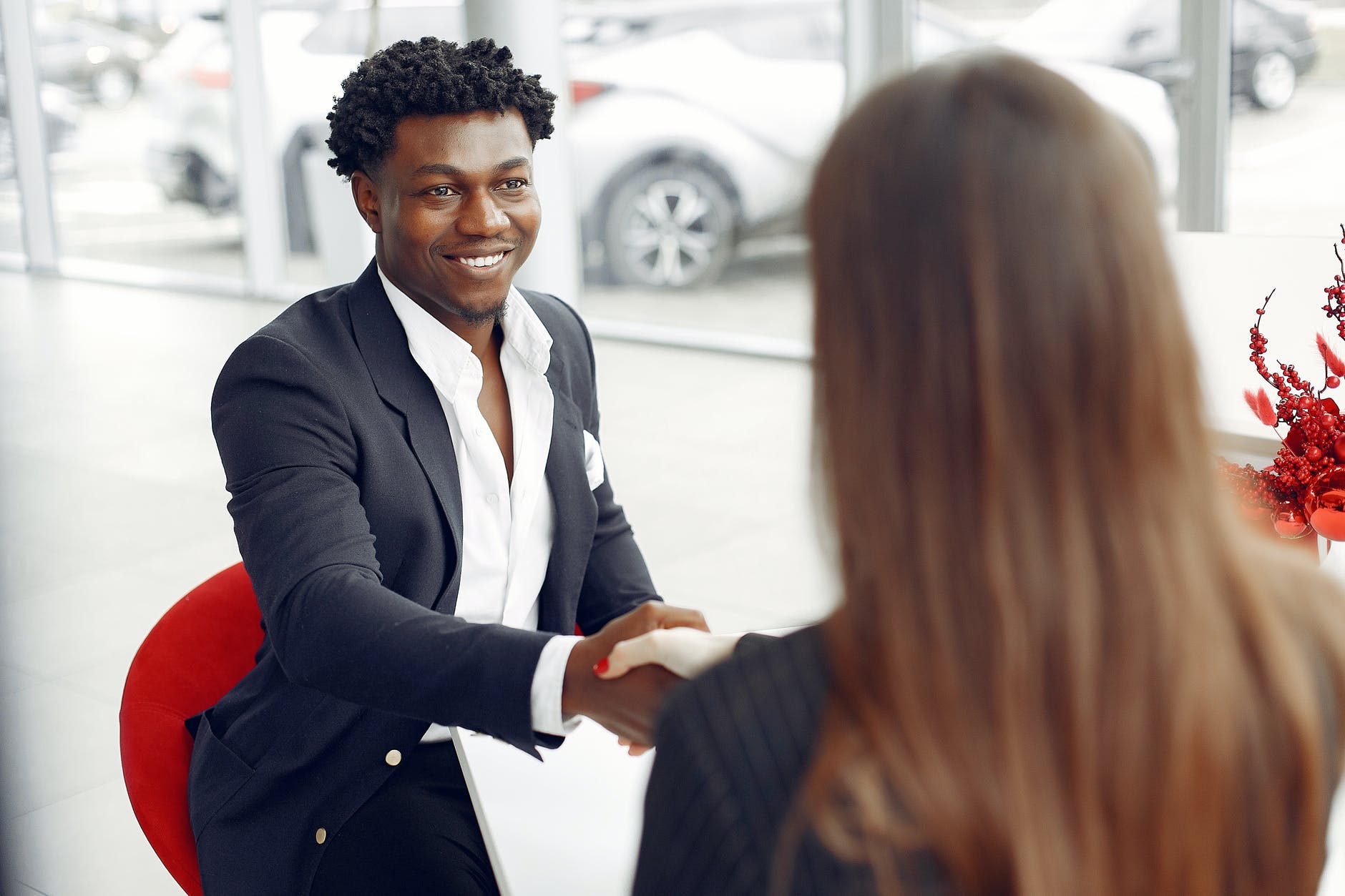 excited buyer shaking hands with agent, smart money bro