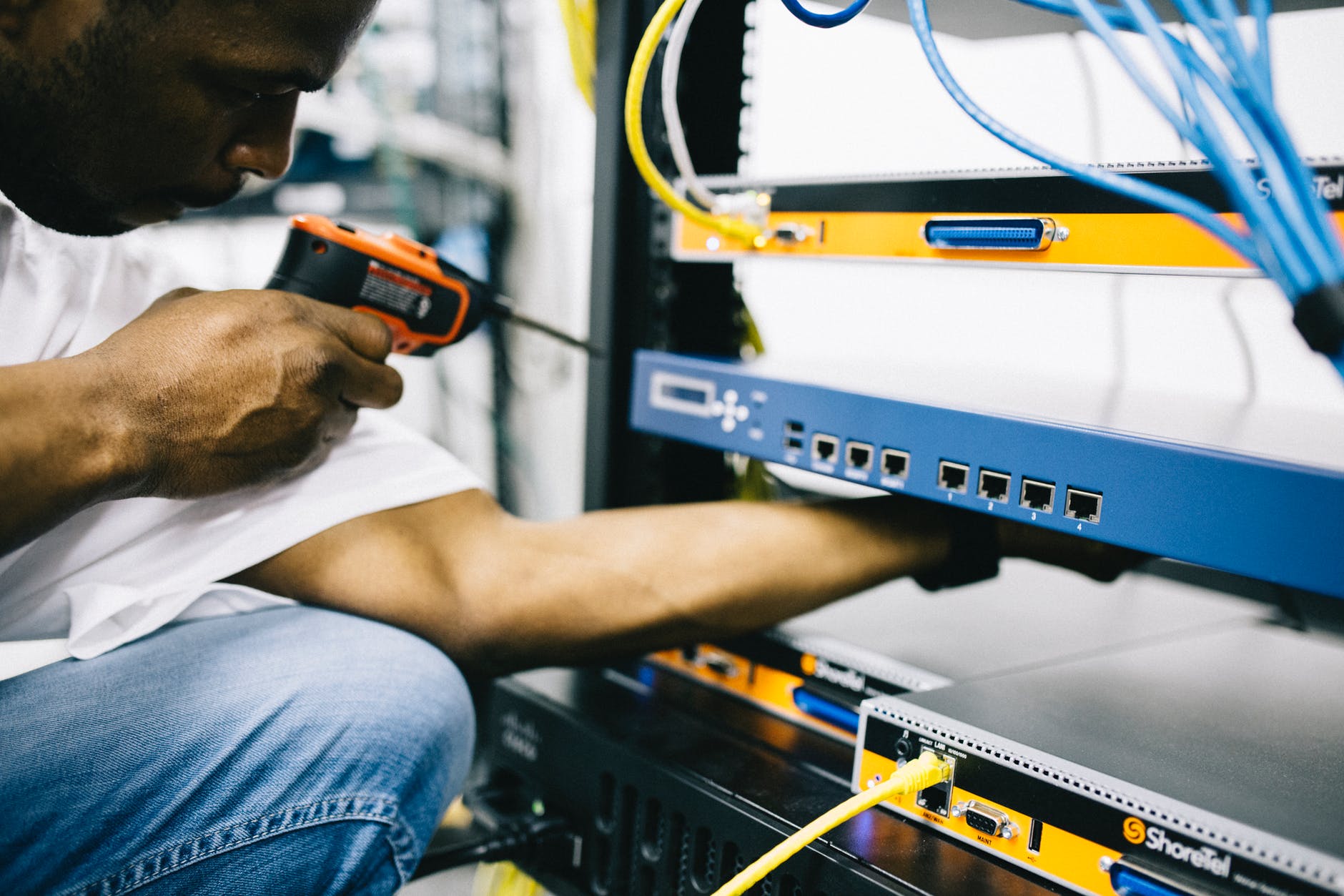 professional crop black technician working with hardware smart money bro