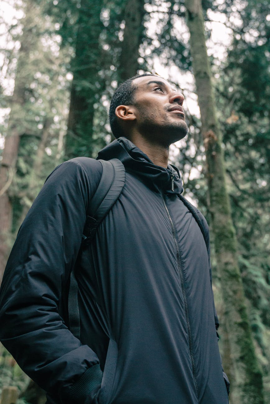 man in black jacket looking upwards